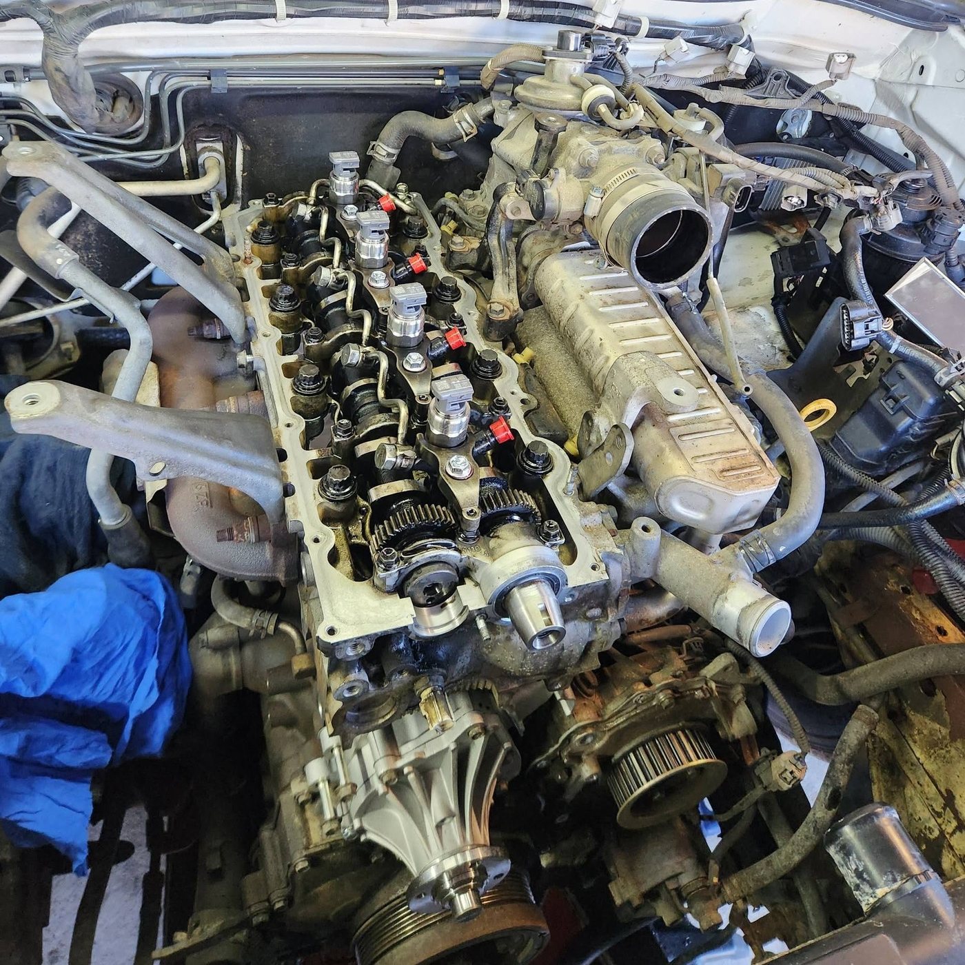 An engine bay stripped down for repair at De Salvo Automotive